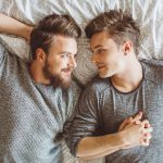 Gay Couple Lying on Bed