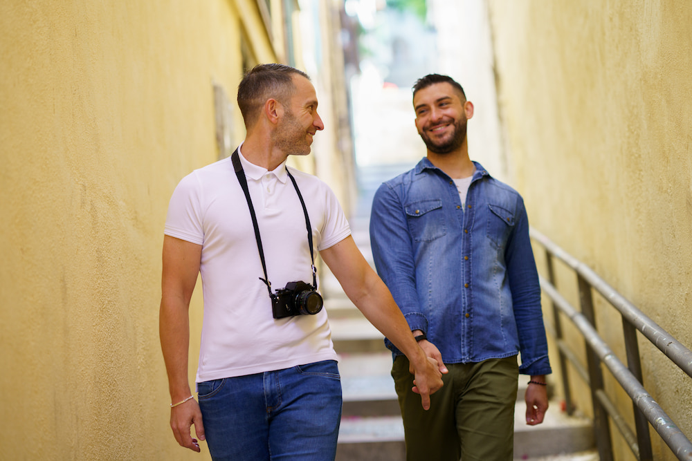 gay-couple-tourists-walking-hand-in-hand-on-the-st-2025-03-24-08-34-17-utc-1 gay-couple-tourists-walking-hand-in-hand-on-the-st-2025-03-24-08-34-17-utc-1